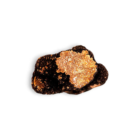 Black truffle with golden interior.
