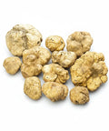 Pale yellow Tuber Magnatum white truffle cluster with earthy texture and natural shape