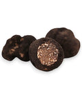 Fresh Winter Truffle Tuber Brumale with textured dark exterior and light interior
