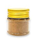 Golden spice jar with yellow lid and clear glass body for Tuber Borchii truffle powder